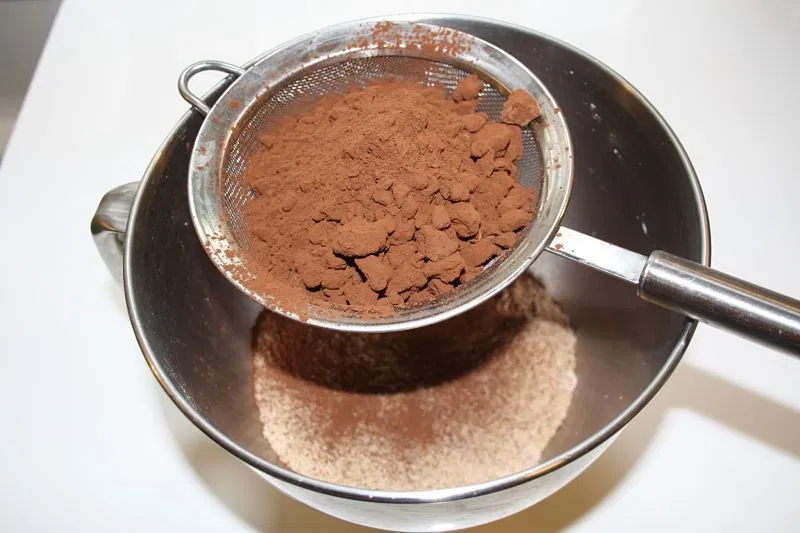 Sieve the coco powder and flour and add to the bowl with sugar.